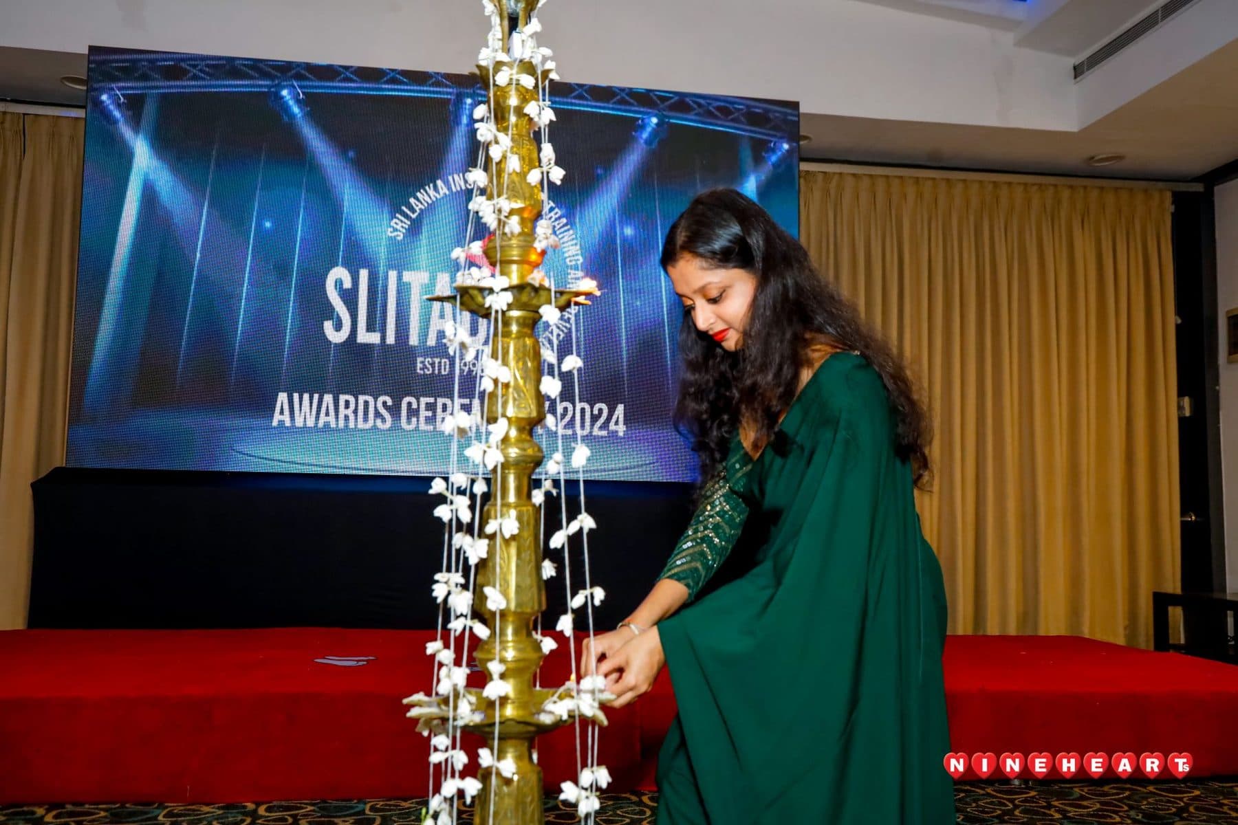 Lighting the lamp at the SLITAD graduation